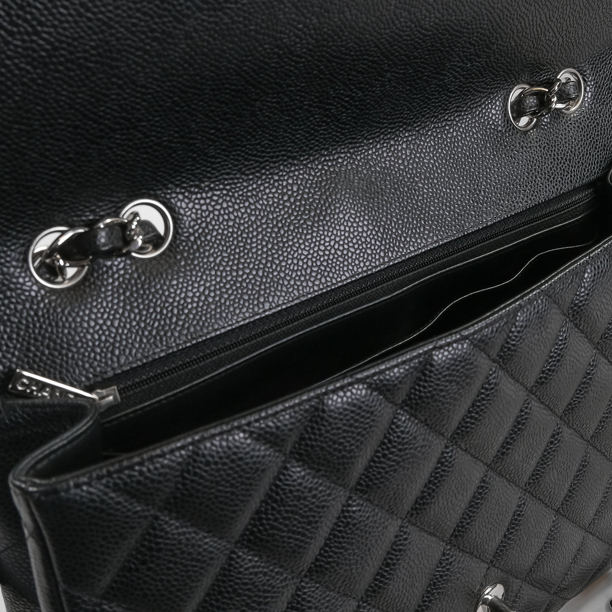 Chanel_Black_Caviar_Jumbo_Classic_Flap_Handbag_1